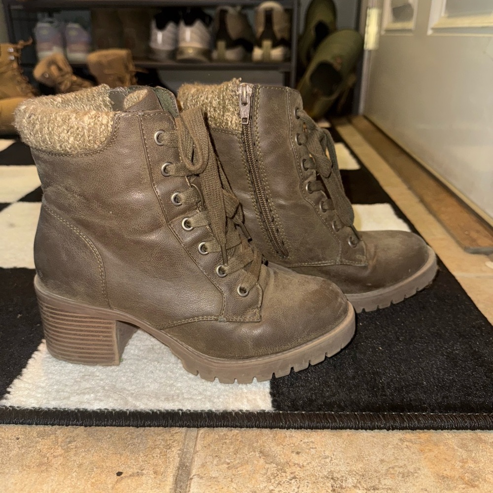 Brown lace-up ankle boots with a chunky heel.